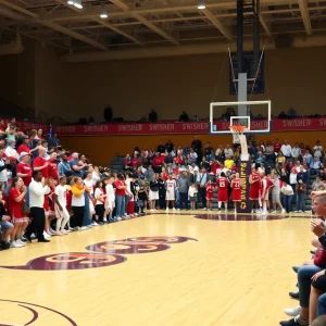 JU Dolphins team celebrating during a basketball game