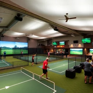 Interior view of Chipshot sports entertainment complex featuring pickleball courts and golf simulators
