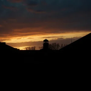 Somber atmosphere of a prison yard at sunset