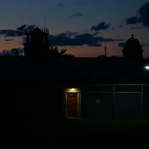 Florida State Prison at dusk, representing a somber atmosphere of justice.