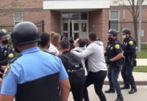 Police officers outside a school during an arrest incident