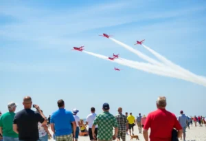 Airplanes performing aerial maneuvers over Jacksonville Beach during the Sea and Sky Air Show.
