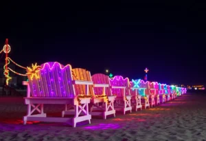 Festively decorated lifeguard chairs at Jacksonville Beach during the Deck the Chairs event.