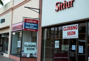 A storefront with a 'Closing Soon' sign in Florida's shopping district.