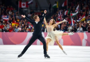 Two figure skaters performing on ice at a championship event.