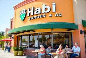Exterior view of Habit Burger & Grill in Jacksonville with people dining outside.