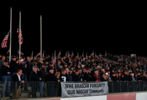 Tribute to NASCAR community members with flags at half-mast.