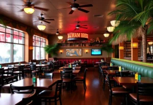 Empty tables inside a Bahama Breeze restaurant with tropical decorations.