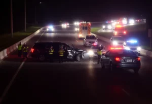 Emergency responders at a four-vehicle crash site on I-84